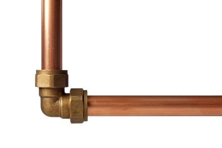 A copper water line pipe with a valve attached.