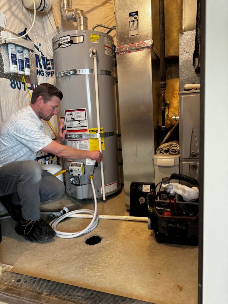 Master Plumber Chris Donahue in Eagle Mountain, Utah Doing a Tank Water Heater Flush